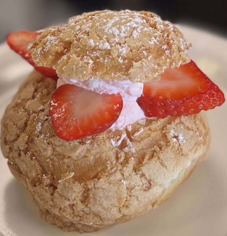 A strawberry cream puff dusted with sugar at Terra Café